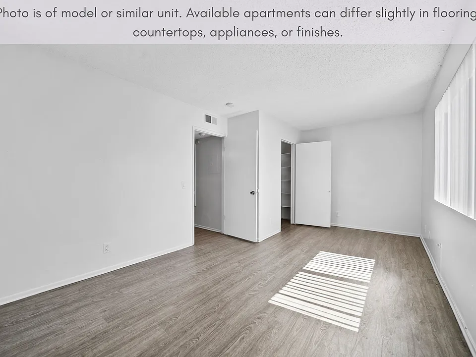 Bright bedroom featuring a comfortable layout and convenient closet storage.