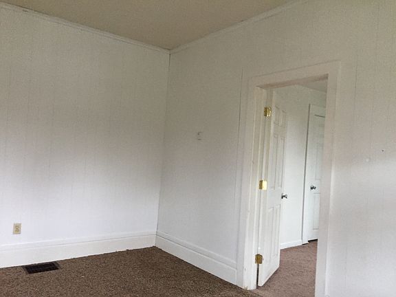 Living room looking into front bedroom