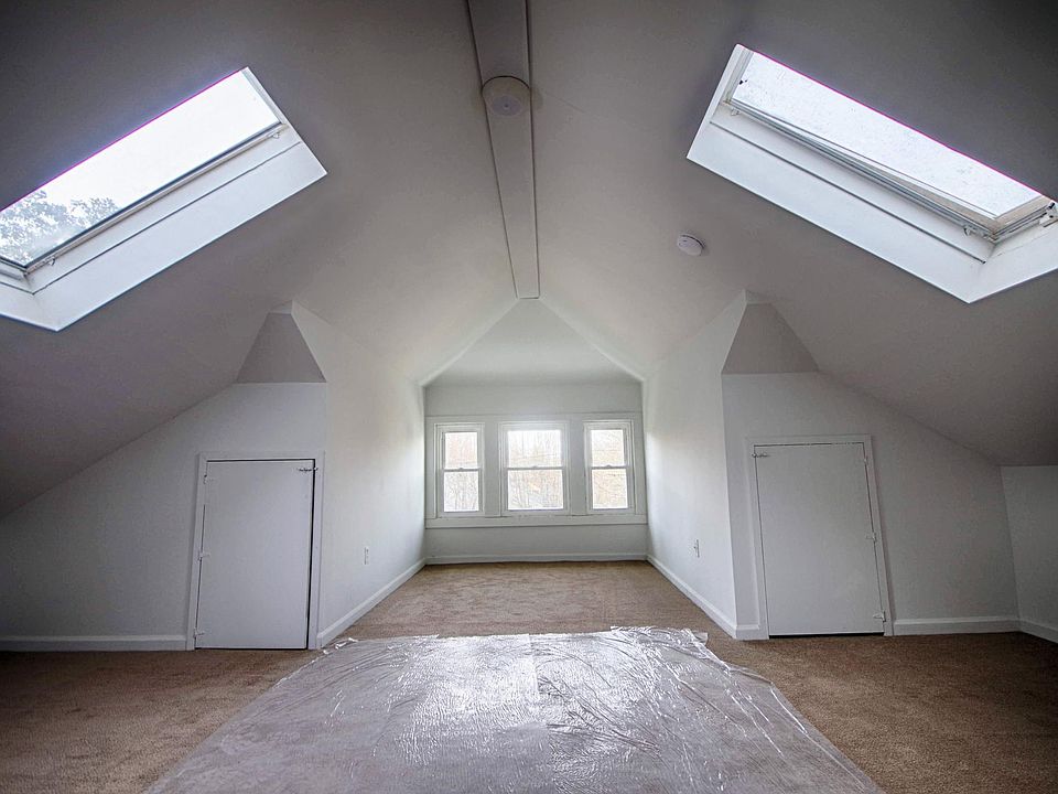 Top floor bedroom, with storage under the eaves