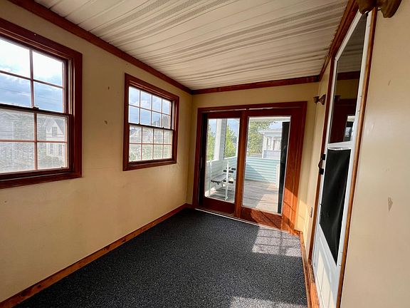 enclosed front porch and open deck