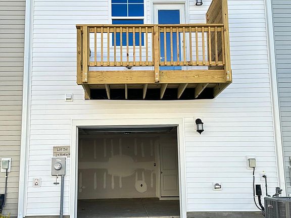 Backside Driveway and Garage entry