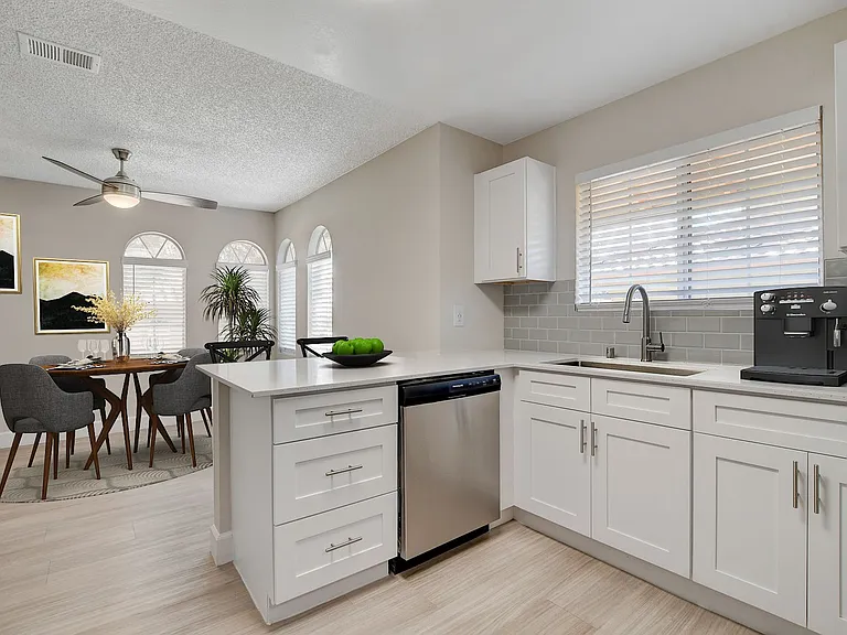 Elevate your living at Invitational, where modern design meets comfort. This stunning kitchen features sleek appliances and stylish finishes, perfect for culinary enthusiasts. Don't miss out on your dream homeschedule a tour today!