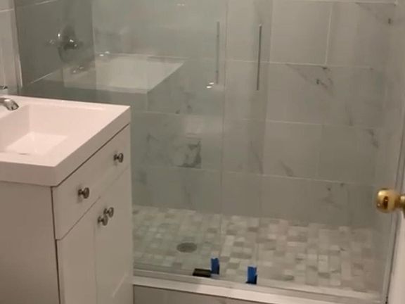 newly renovated bathroom with rain shower