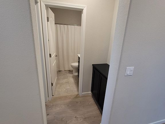 Entry way to downstairs bathroom and bedroom