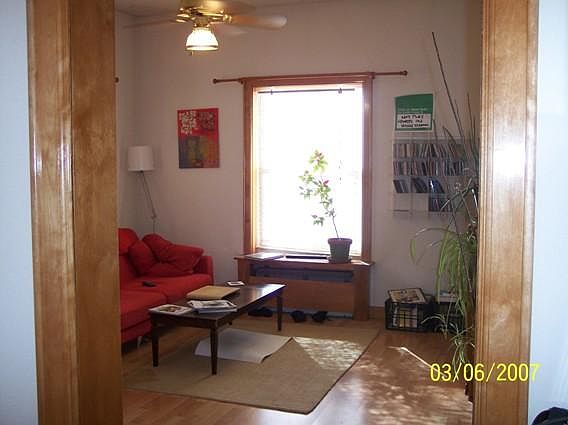 Living from entry foyer (S & E facing windows)