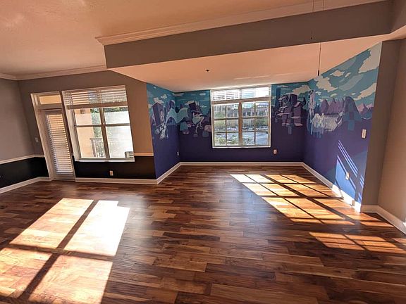 The Den/dining area and balcony entrance - the living room gets lots of natural light!