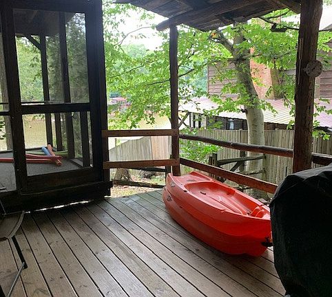 Side Porch with Gas Grill and Table and Chairs to Seat 6