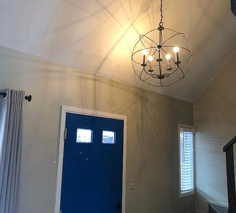 front door and stairs to bedroom and bathroom