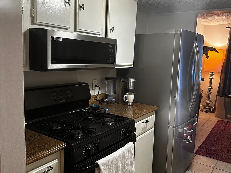 Kitchen, gas rnge, slim OTR microwave, stainless french door and lower freezer
refrigerator