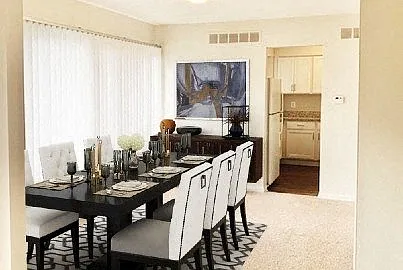 Large formal dining room with window wall.