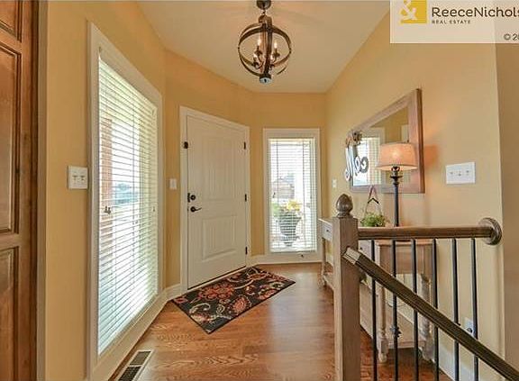 Generous Entry with hardwood flooring.