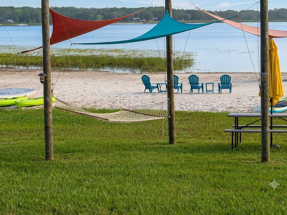Golden sand and sparkling clear blue water invites you to relax in the Adirondack chairs or nap in the swinging two person hammock. Picnic anyone or maybe a paddle in the kayaks, canoe, peddle boat or paddleboards?