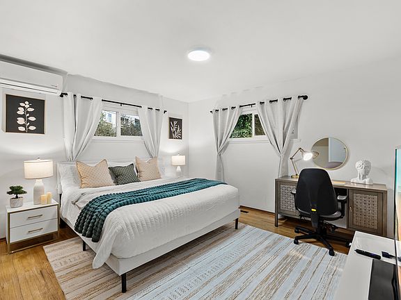 Cozy bedroom with a workspace that inspires creativity and productivity.