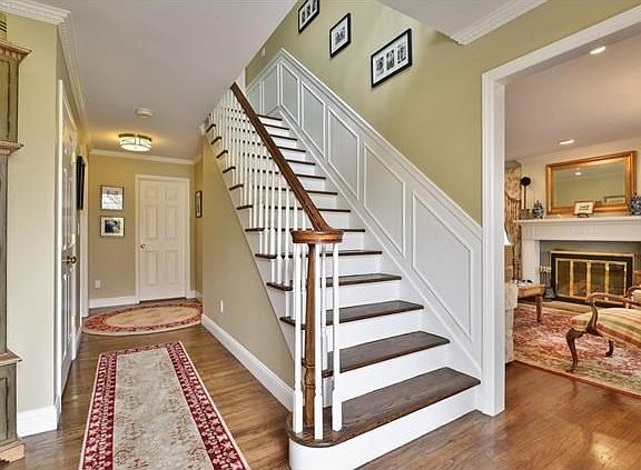 Gracious entry foyer to this classic center hall colonial