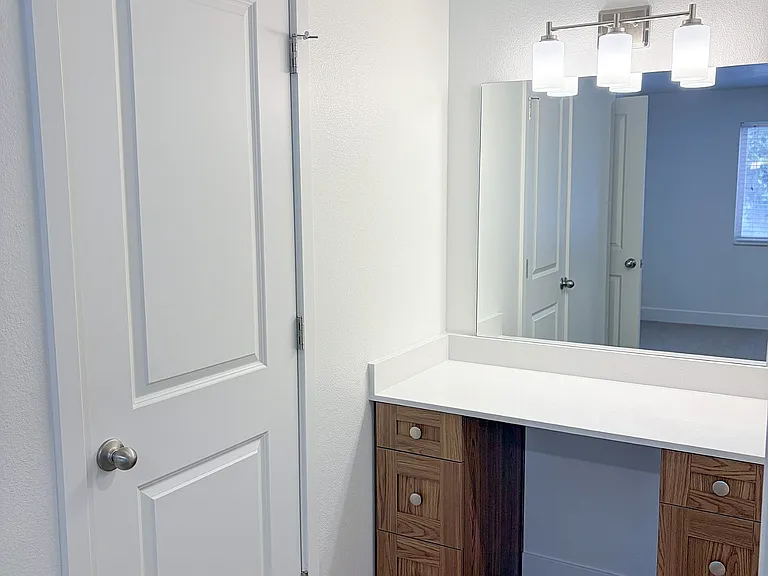 Dedicated vanity space adds convenience and functionality to your daily routine.