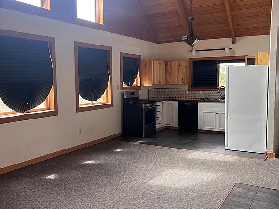 Living/dining area with open kitchen