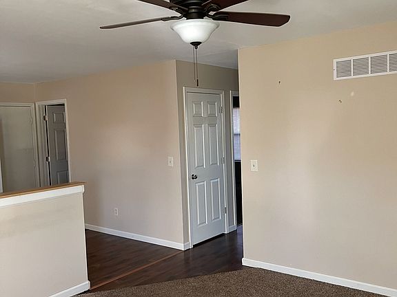 Partial picture of Family Room and Door to Large Food Pantry.