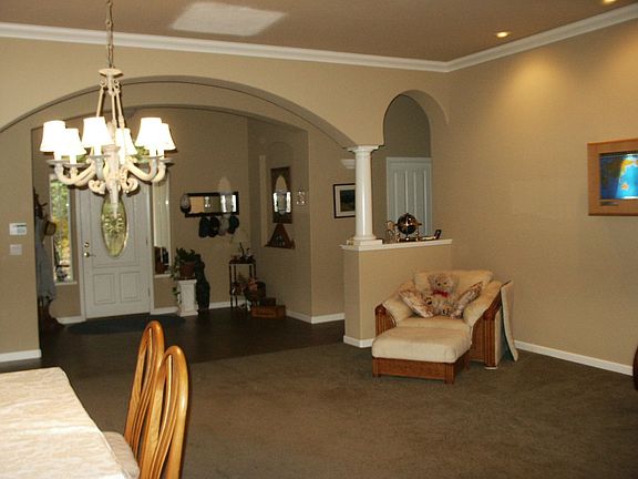 Throughout the home you'll enjoy the 10' high coffered ceilings and either ind