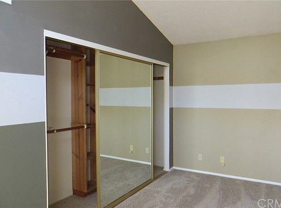 Bedroom with mirrored closet