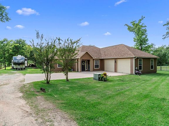 The custom built home boasts a partially wooded lot and an abundance of space.