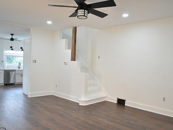 Open concept living area view into kitchen.