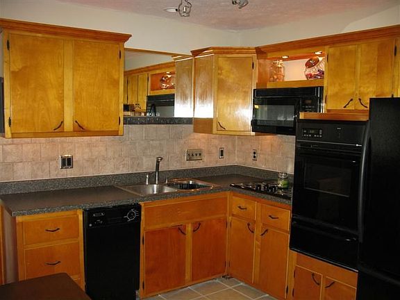 Kitchen with new counters and tile floor
