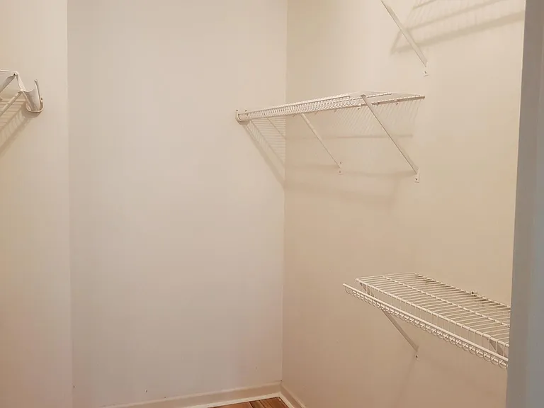 Walk in closet in the primary bedroom