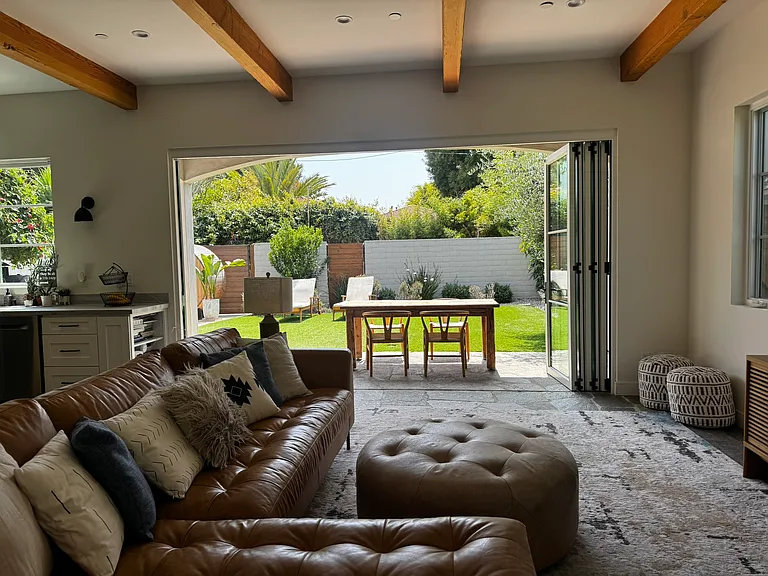 The great room opens to the spacious backyard for integrated indoor/outdoor living