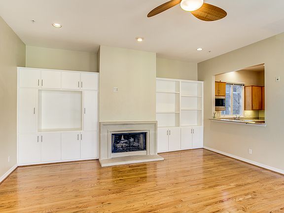 Main Living Area on the 2nd Floor has handsome Hardwood Floors & gas Fireplace