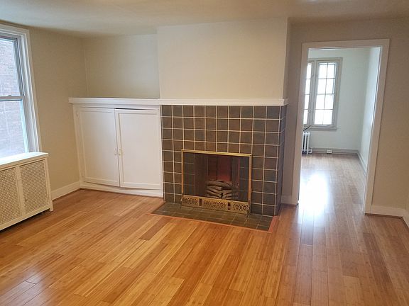 Living room w/ decorative fireplace
