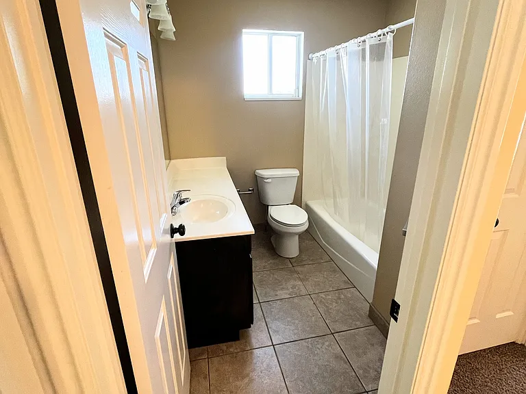 Bathroom with tile flooring