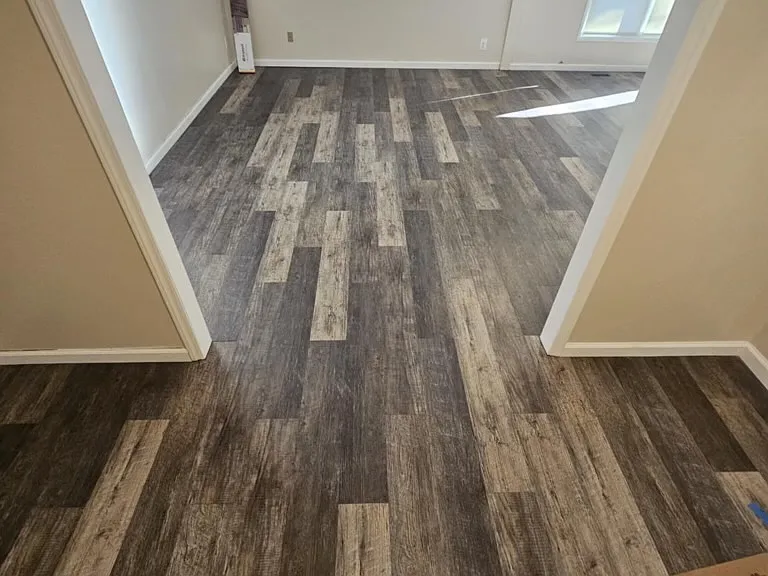 Brand new flooring throughout the entire house. Bedrooms are carpet.