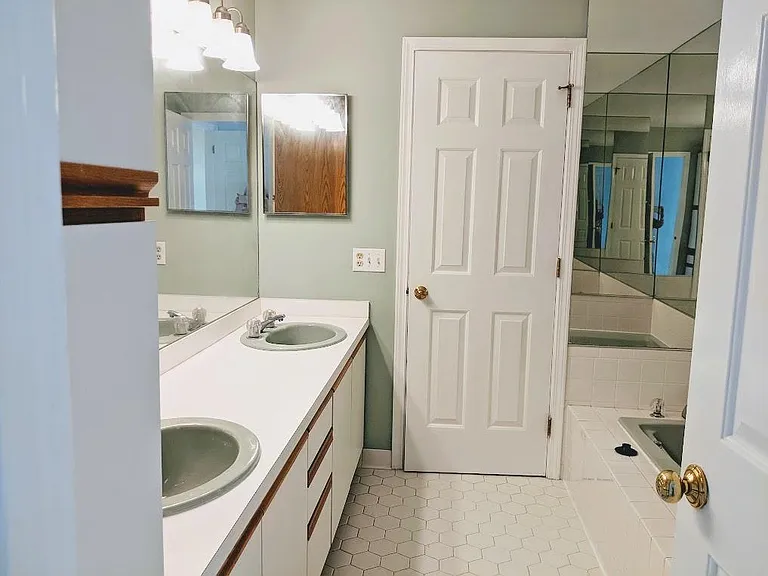 Master Bathroom with a separate shower stall and jacuzzi