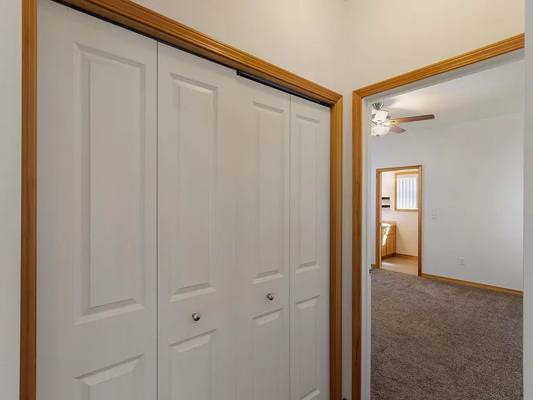 Washer and dryer located in large hall closet.