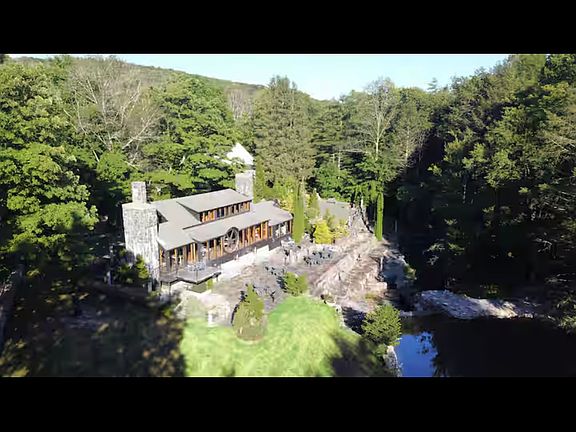 Ariel view of in back of property at waters edge