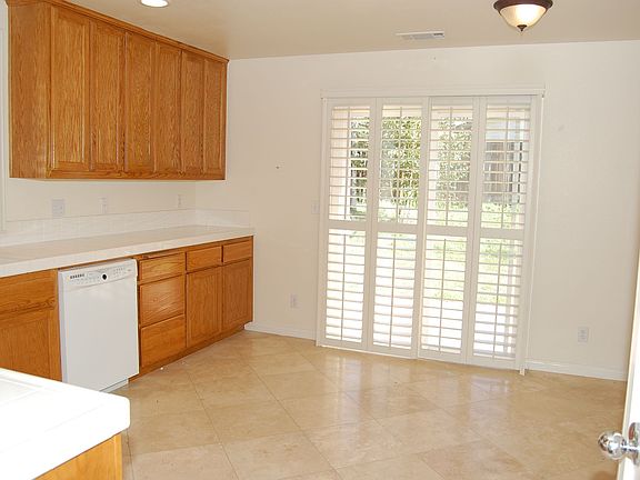 More Travertine in Kitchen with Access to Back Yard!
