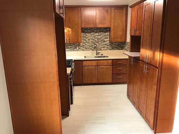 Kitchen with stainless stove and sink.