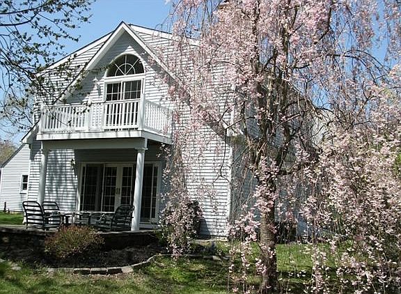 Rear View of Patio off Family Room, Balcony from Master Bedroom