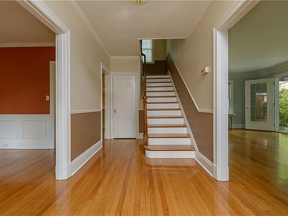 Enter into the main floor with gleaming hardwood floors.