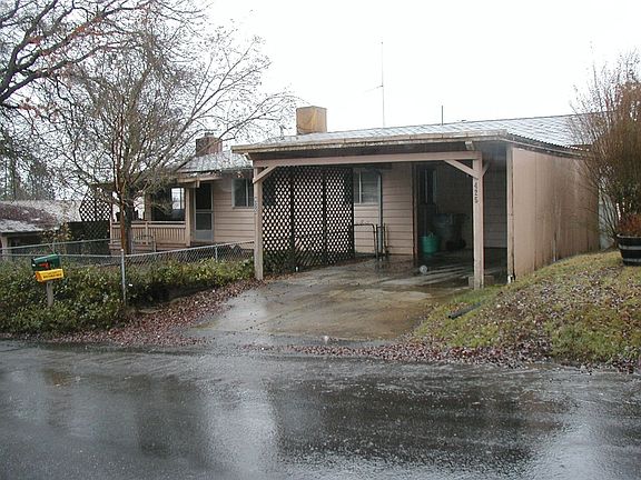 View of carport & garage