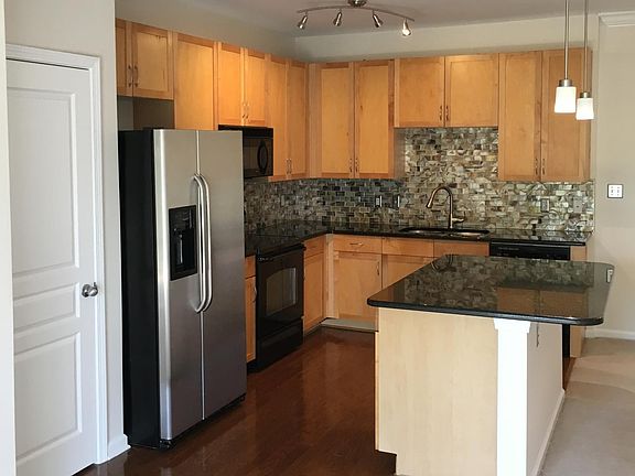 Fully renovated Kitchen with granite countertops and tile backsplash