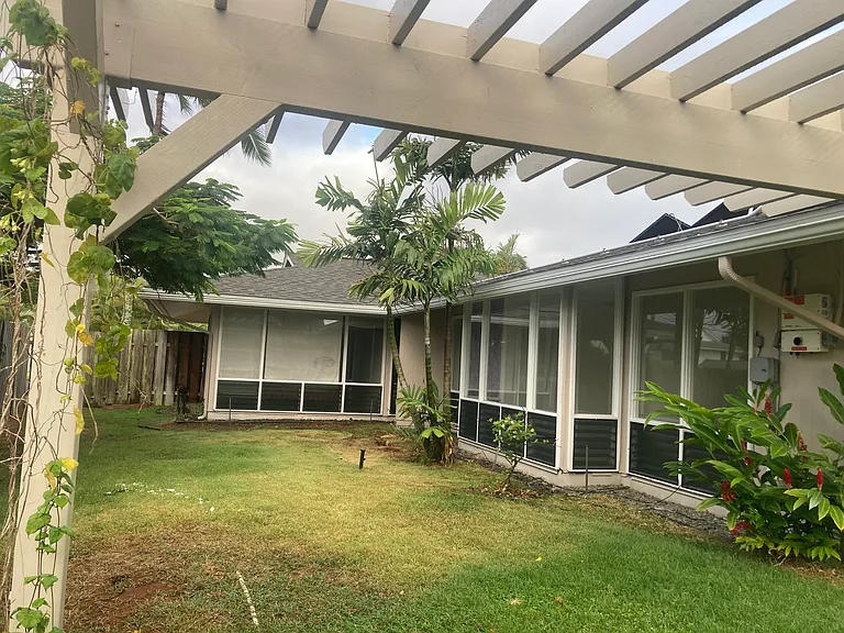 Side with all the bedrooms facing the yard.