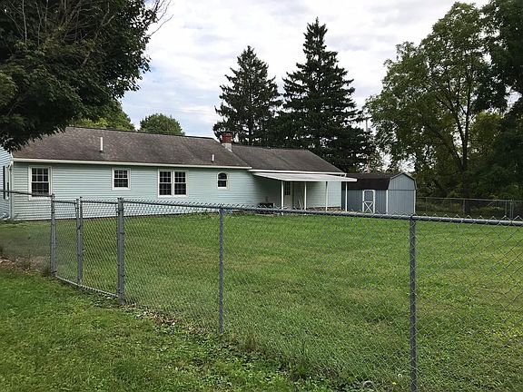 Fenced in back yard with covered patio!
