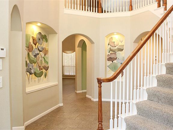 FIRST IMPRESSSIONS ARE IMPORTANT...ARCHETECHTURAL TOUCHES FLOW THROUGHOUT THE HOME.