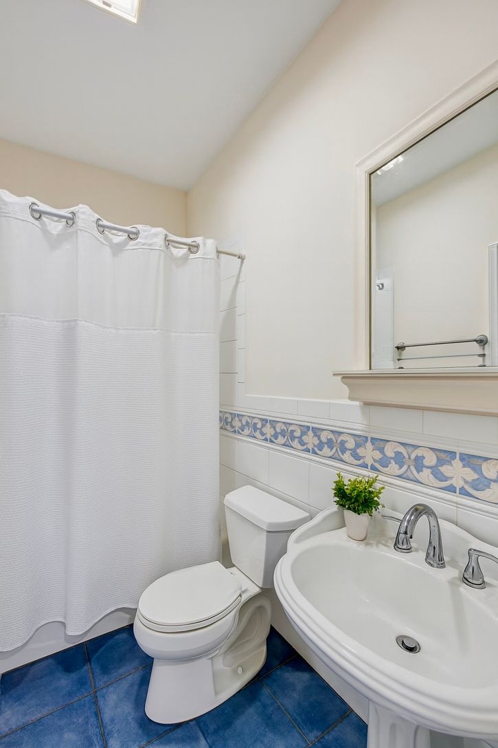 A beautifully appointed full en suite bath designed for relaxation and convenience.