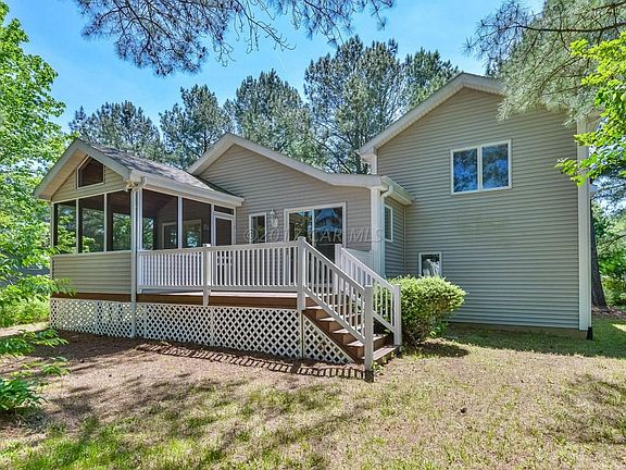 Rear of Home w/ Sc. Porch & Deck
