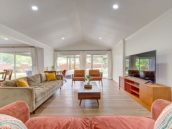 Beautiful large mid-century open concept living room with plenty of daylight