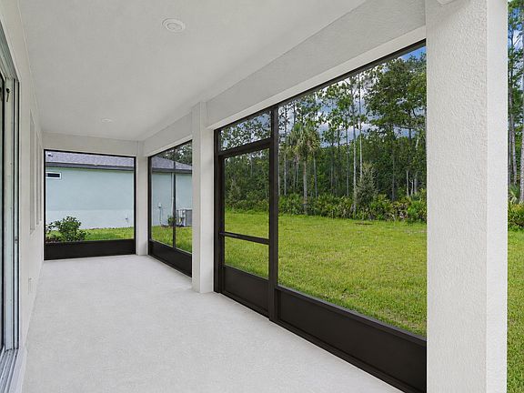 Extended covered fully screened patio with overhead lights. 24' long.