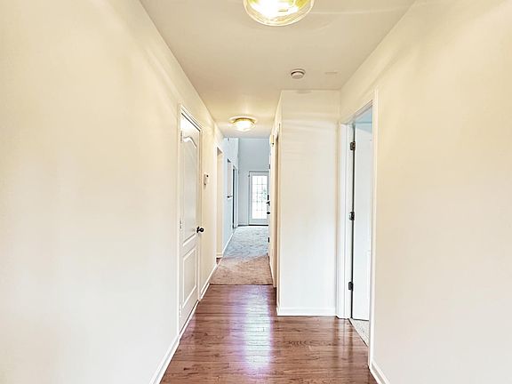 Foyer Entry with Hardwood Flooring