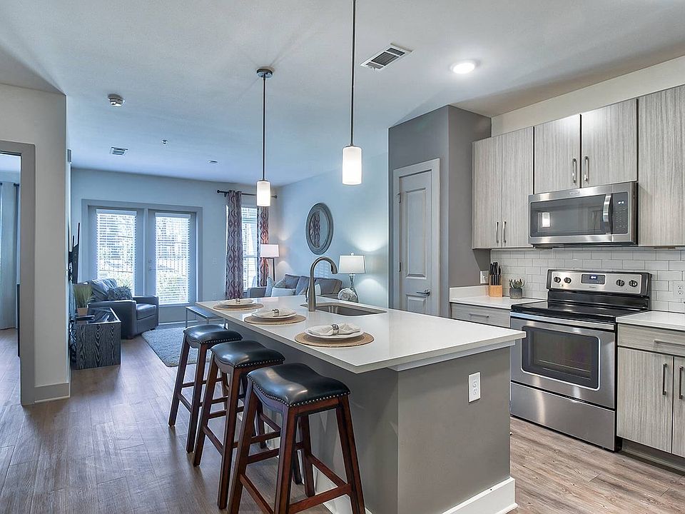 Gourmet kitchens with quartz countertops and modern cabinets with under cabinet lighting